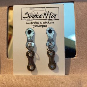 Unique metal dangle earrings made from repurposed bike chains. Metal unknown